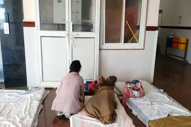 Patients lying on the ground