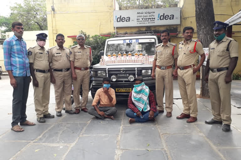 two persons arrested for smuggling alcohol