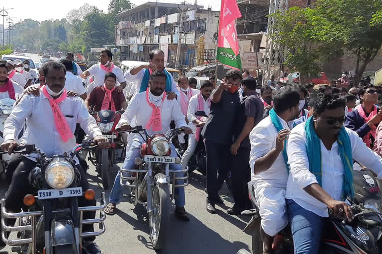 minister indrakaran and trs activists bike rally in nirmal