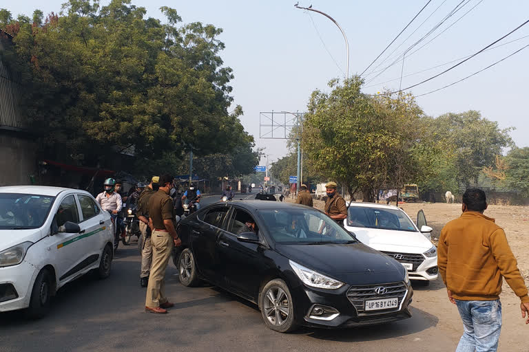 police checking vehicle at border