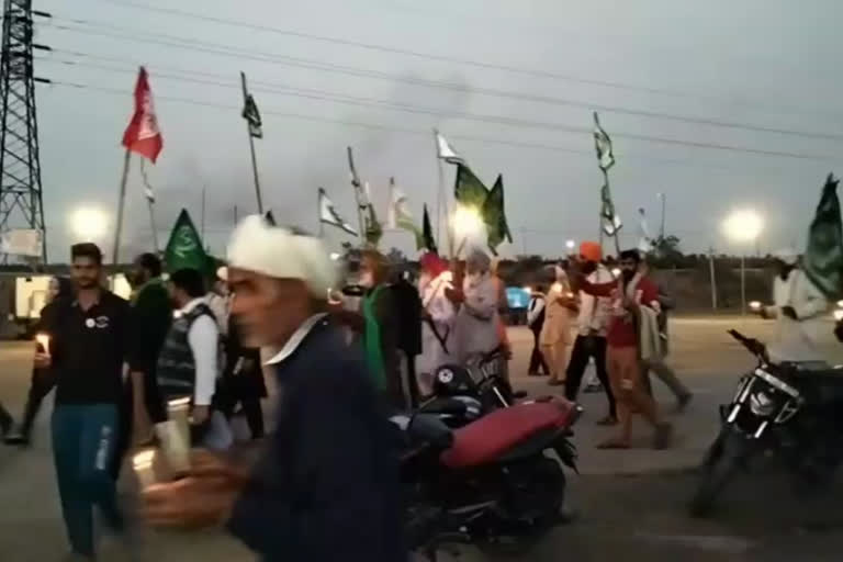 farmers take out candle march in burari ground