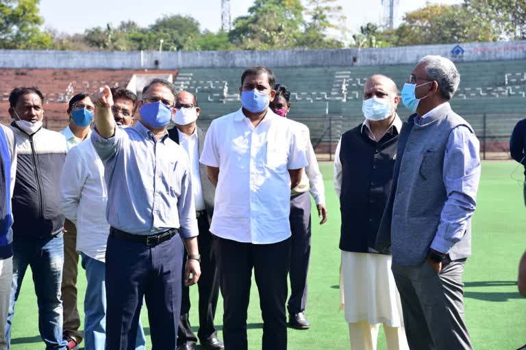 International Hockey Federation officials survey the preparation in Rourkela stadium for Hockey World Cup 2023