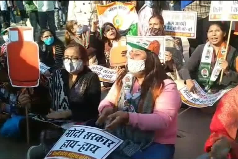 Congress women workers protest in Delhi's Palika Bazar against the rising prices of LPG