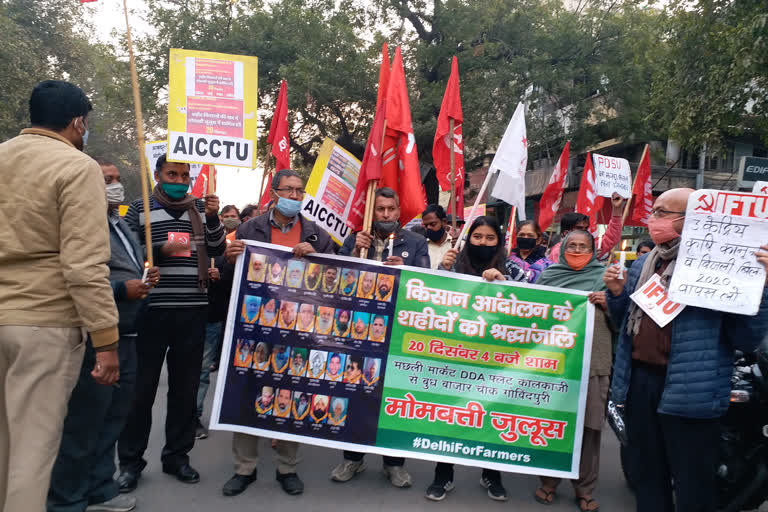 candle march in support of farmers in govind puri