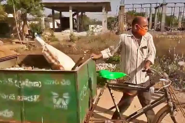 The ward member climbed into the garbage cart