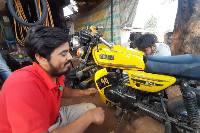 youth made bike from waste material