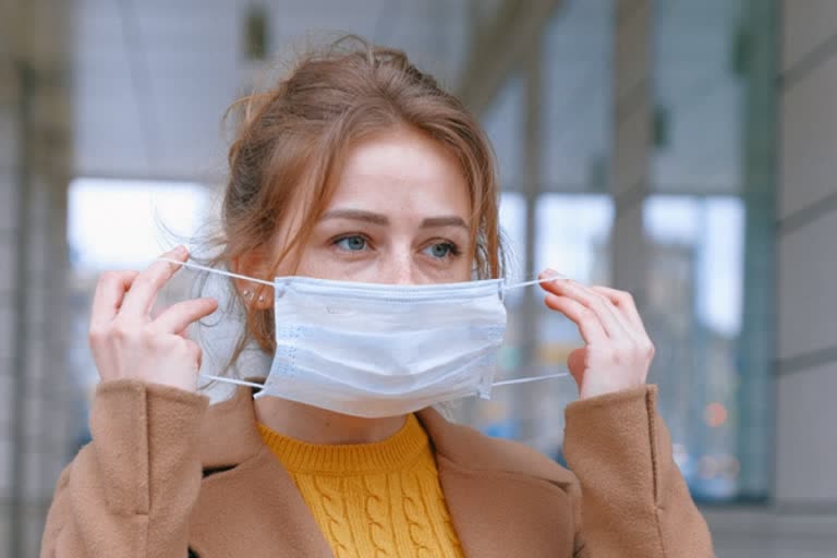 Masks alone may not stop COVID-19 spread without physical distancing, study says