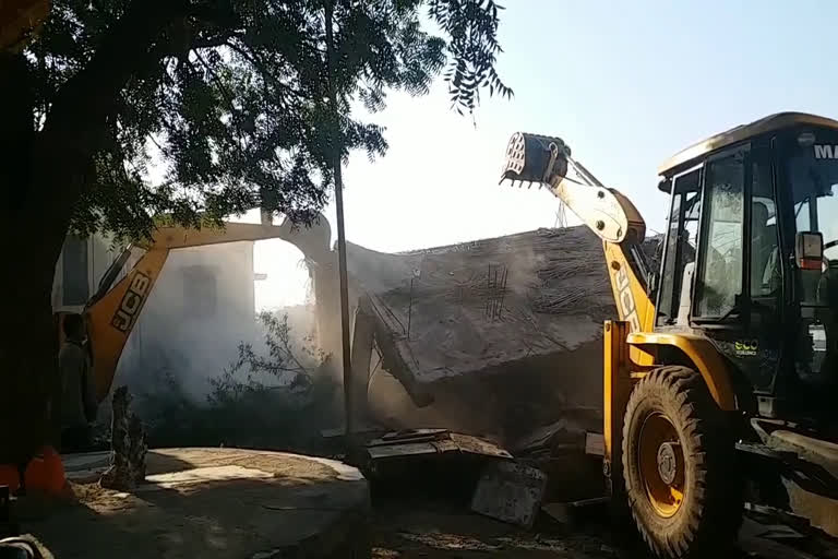 Bulldozer on illegal construction