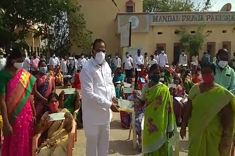 minister mallareddy distributed cheques to beneficiaries 