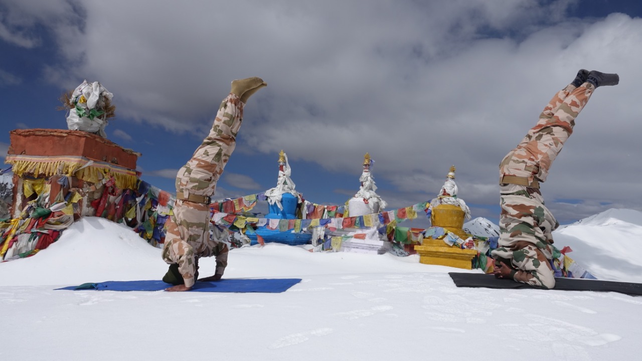 ITBP (Indo-Tibetan Border Police) personnel perform yoga at Khardung La, at an altitude of 18000 feet