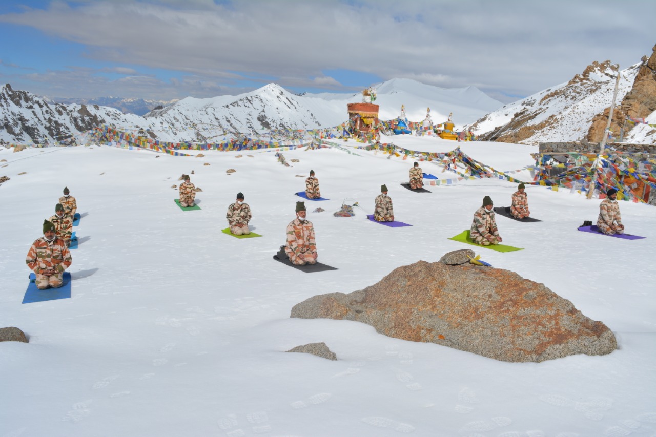 ITBP (Indo-Tibetan Border Police) personnel perform yoga at Khardung La, at an altitude of 18000 feet