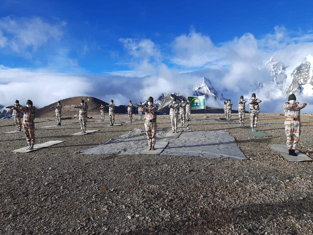 ITBP (Indo-Tibetan Border Police) personnel perform yoga at Khardung La, at an altitude of 18000 feet