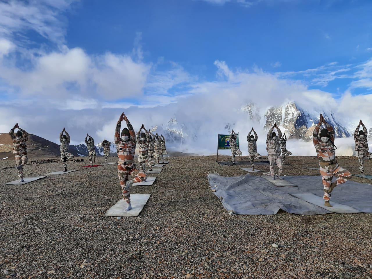 ITBP (Indo-Tibetan Border Police) personnel perform yoga at Khardung La, at an altitude of 18000 feet