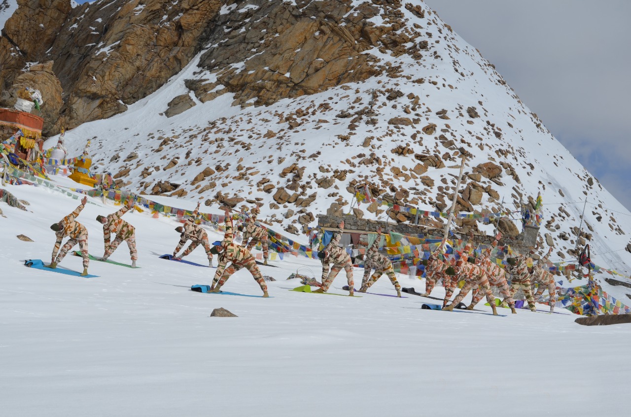 ITBP (Indo-Tibetan Border Police) personnel perform yoga at Khardung La, at an altitude of 18000 feet