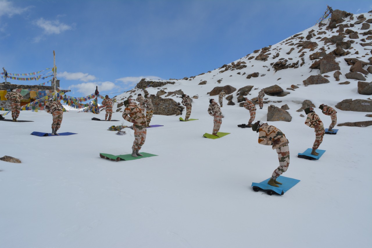 ITBP (Indo-Tibetan Border Police) personnel perform yoga at Khardung La, at an altitude of 18000 feet