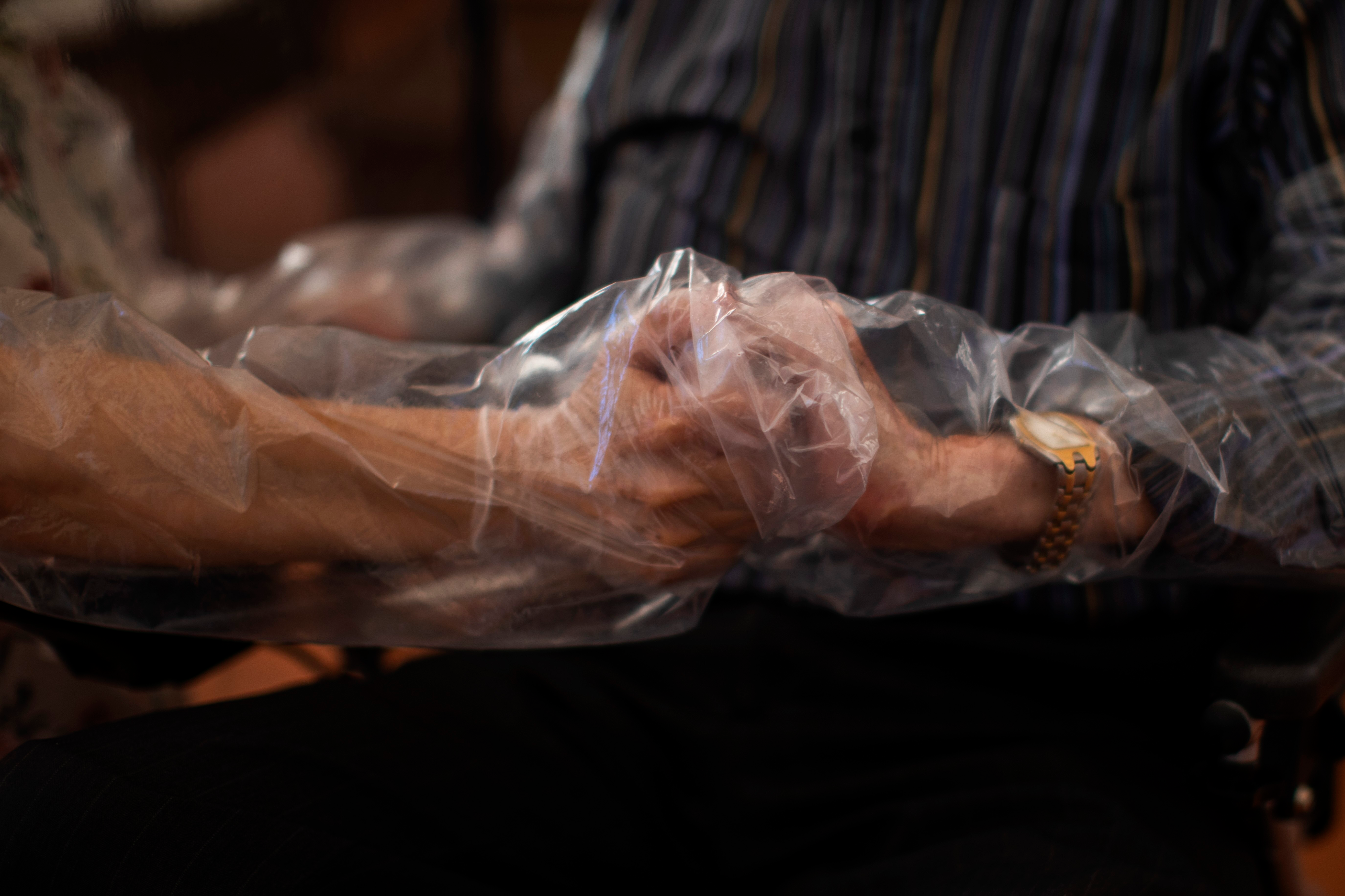 plastic-keeps-virus-not-love-away-from-spain-nursing-home