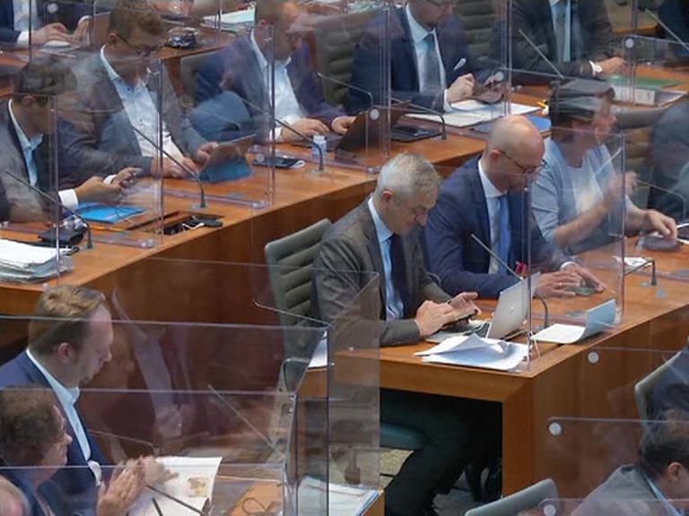 with the lawmakers separated by acrylic glass boxes in the Parliament session in Germany