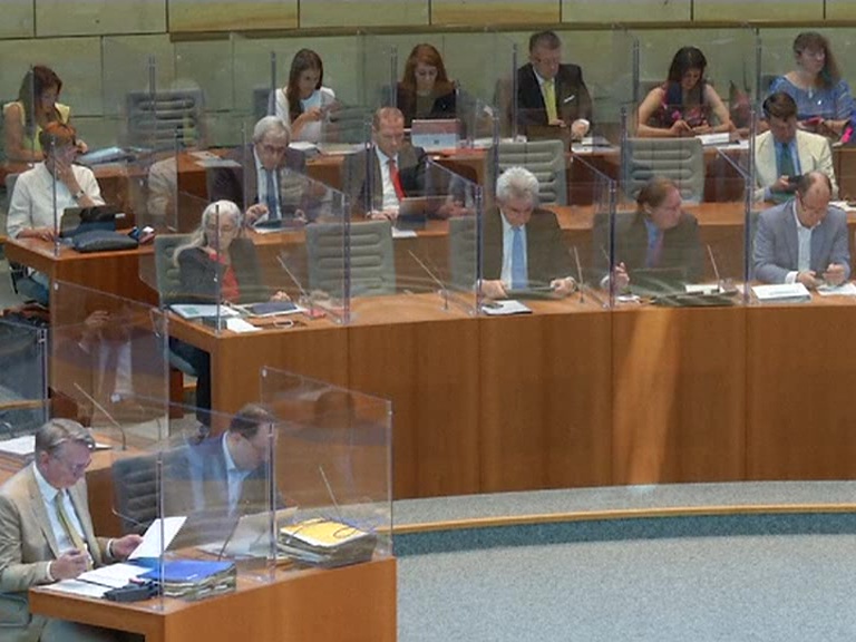 with the lawmakers separated by acrylic glass boxes in the Parliament session in Germany