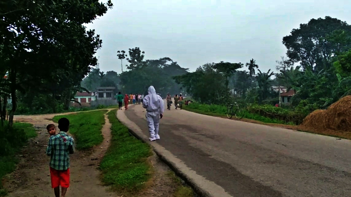 a people with ppe kit spreading covid terror