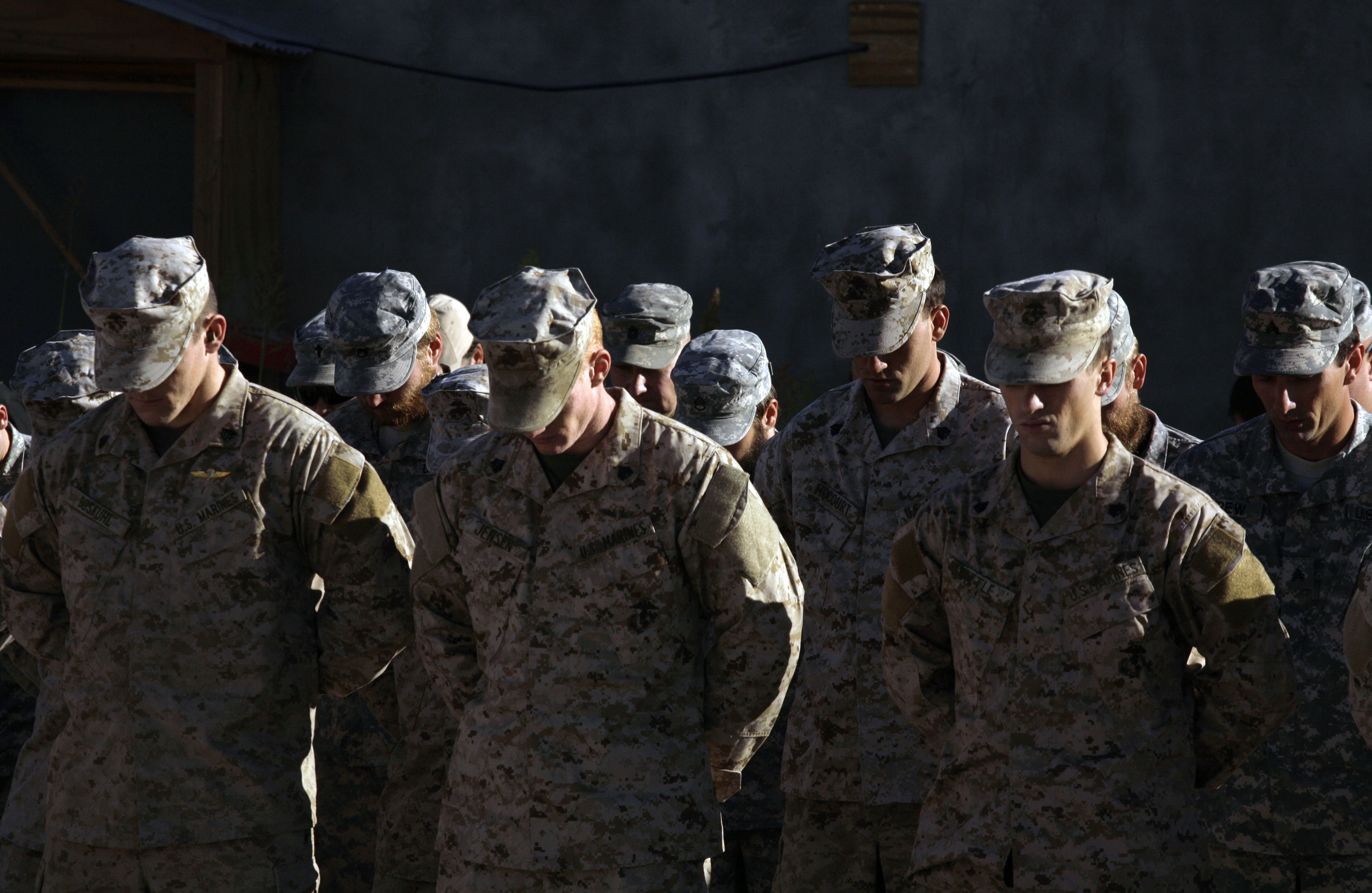 US service members are seen during a memorial ceremony for a comrade killed on Saturday in Afghanistan's Farah province. (File pic)