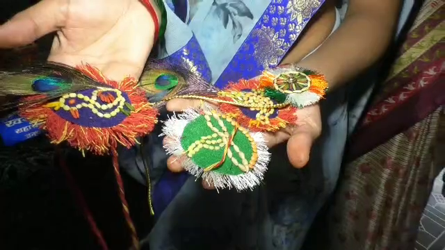 Mollies and peacock feathers rakhi