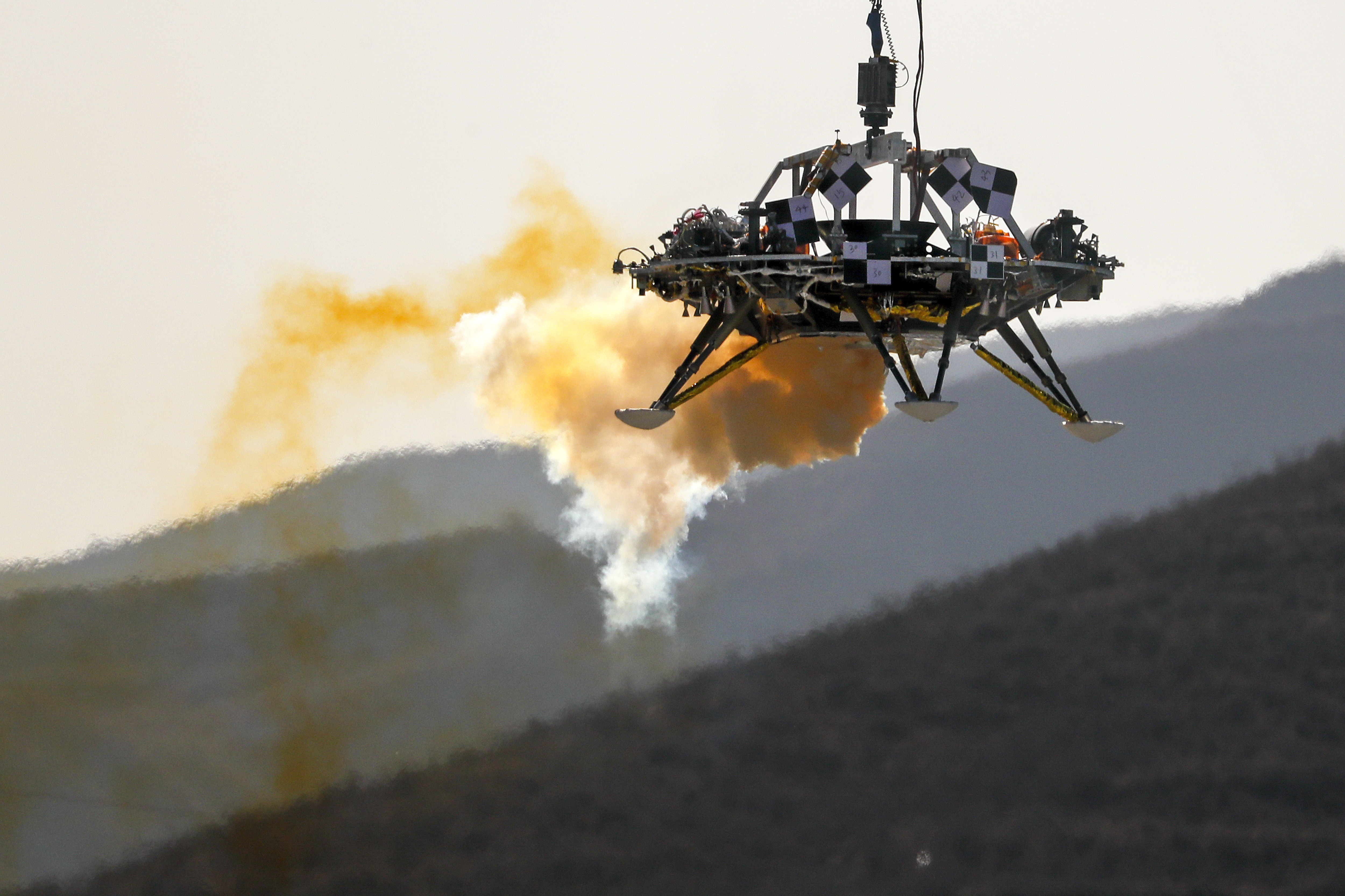 The Mars lander's hovering, obstacle avoidance and deceleration capabilities are tested at a facility at Huailai in China's Hebei province.