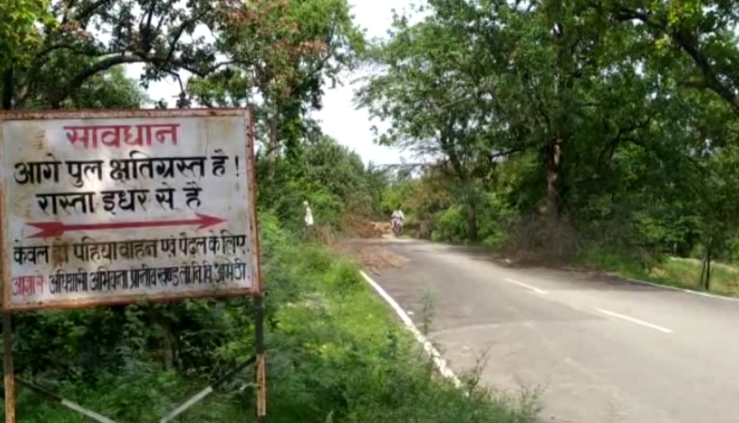 people are forced to pass through a broken bridge