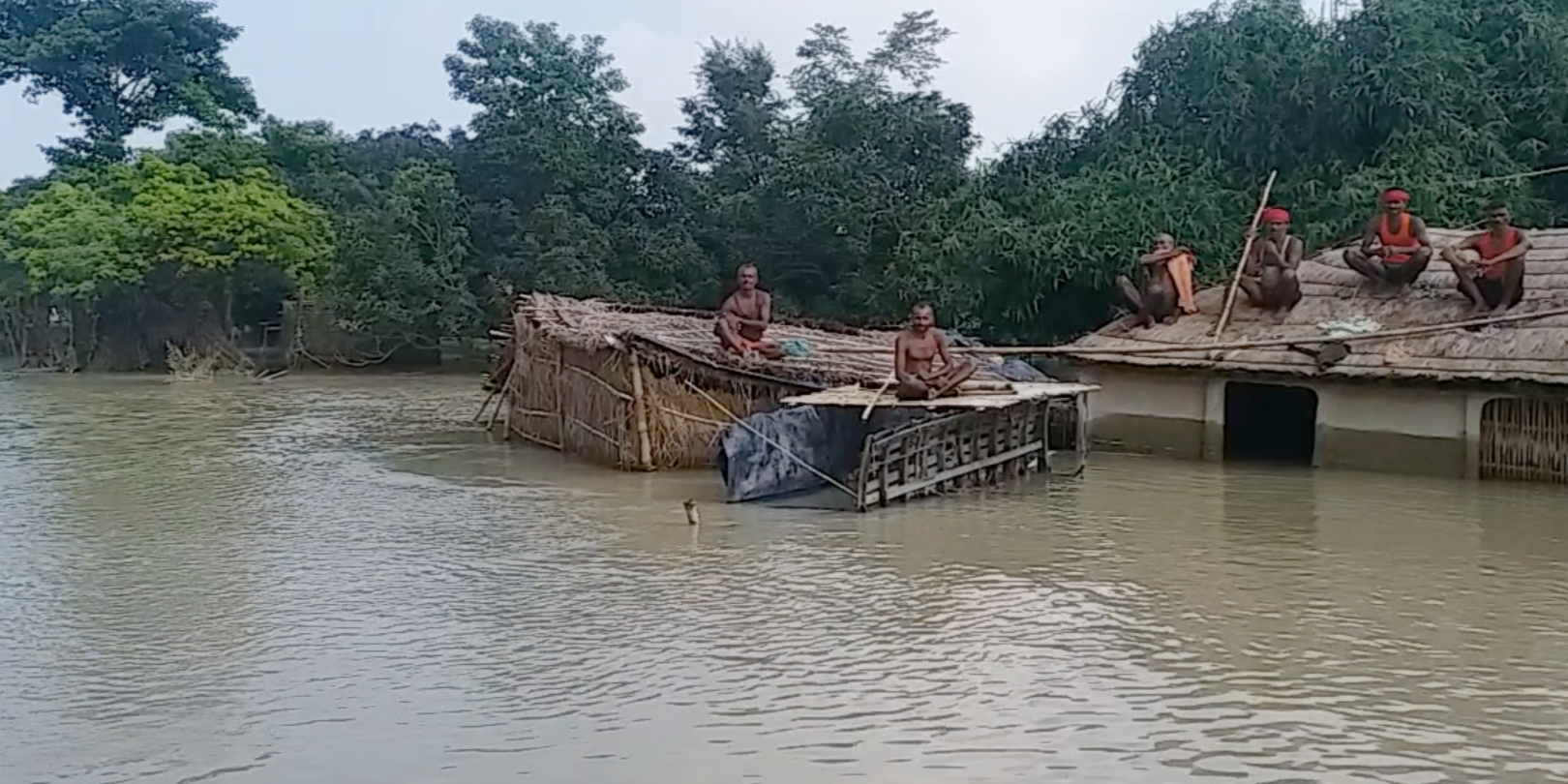 Bihar villagers forced to settle on rooftop of their huts as floods wreak havoc