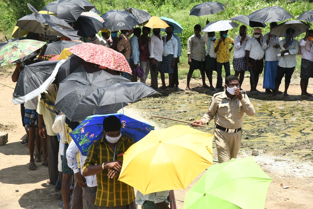 people forgotten rules at front of wine shop at lingayapalem