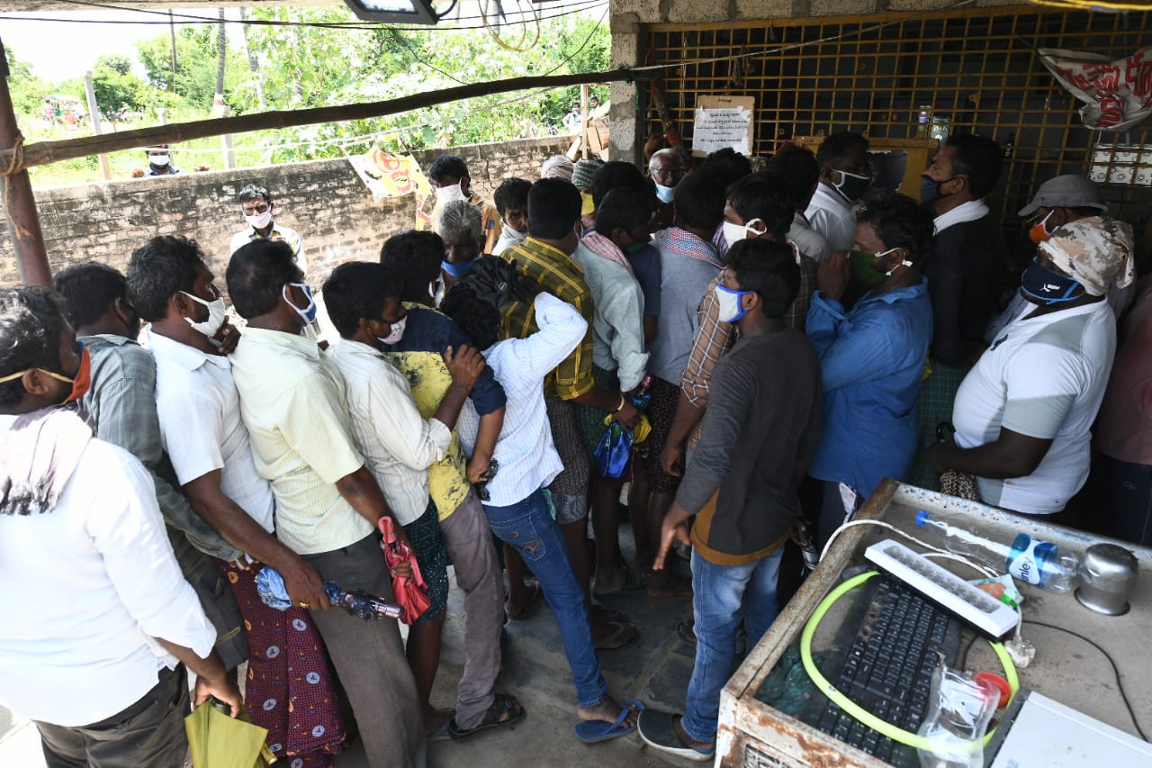 people forgotten rules at front of wine shop at lingayapalem