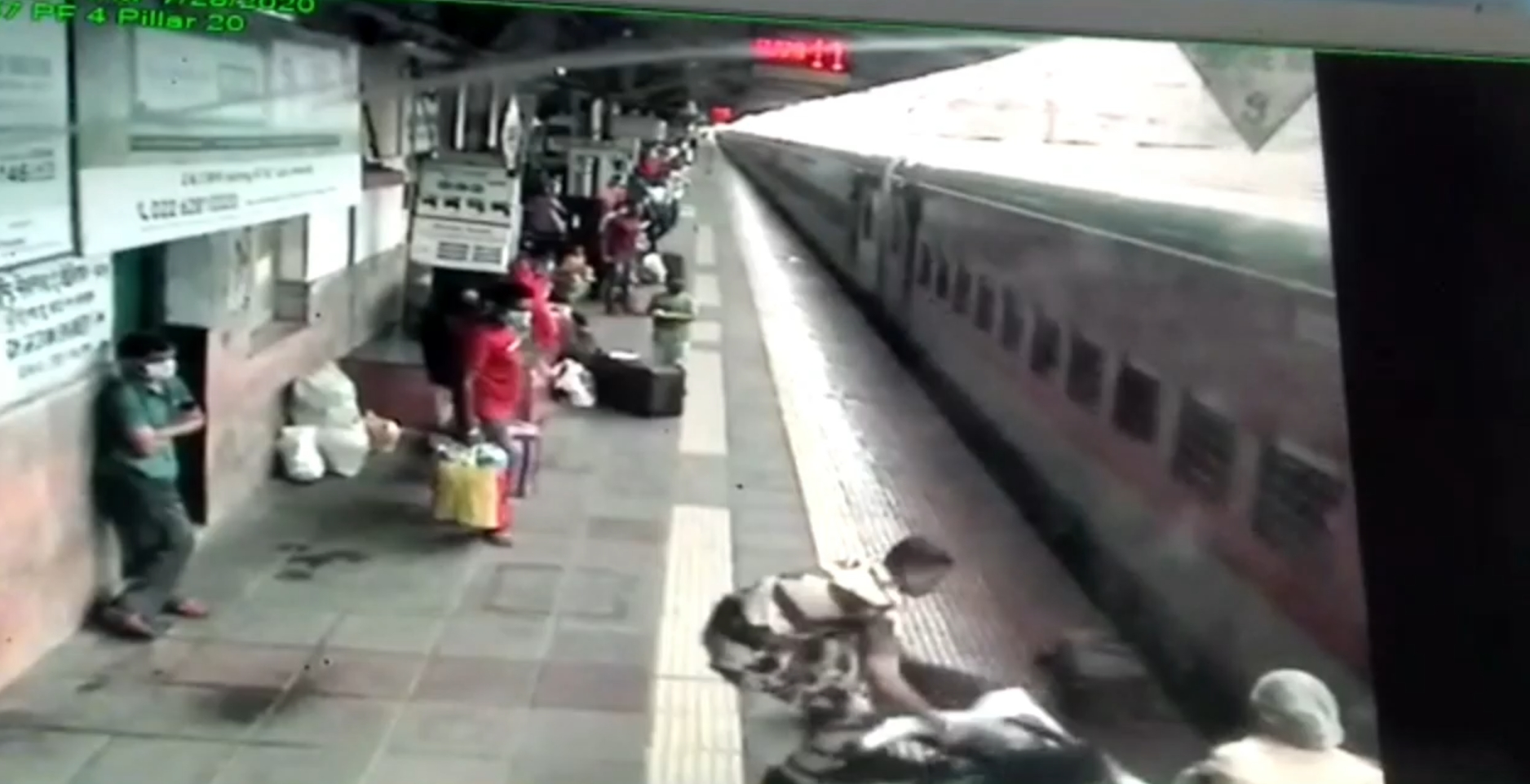 CCTV footage of a passenger being rescued in mumbai maharashtra