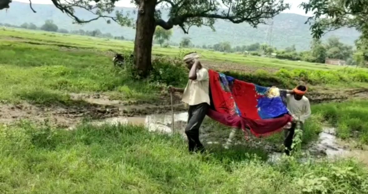 Villagers take the patient to bed