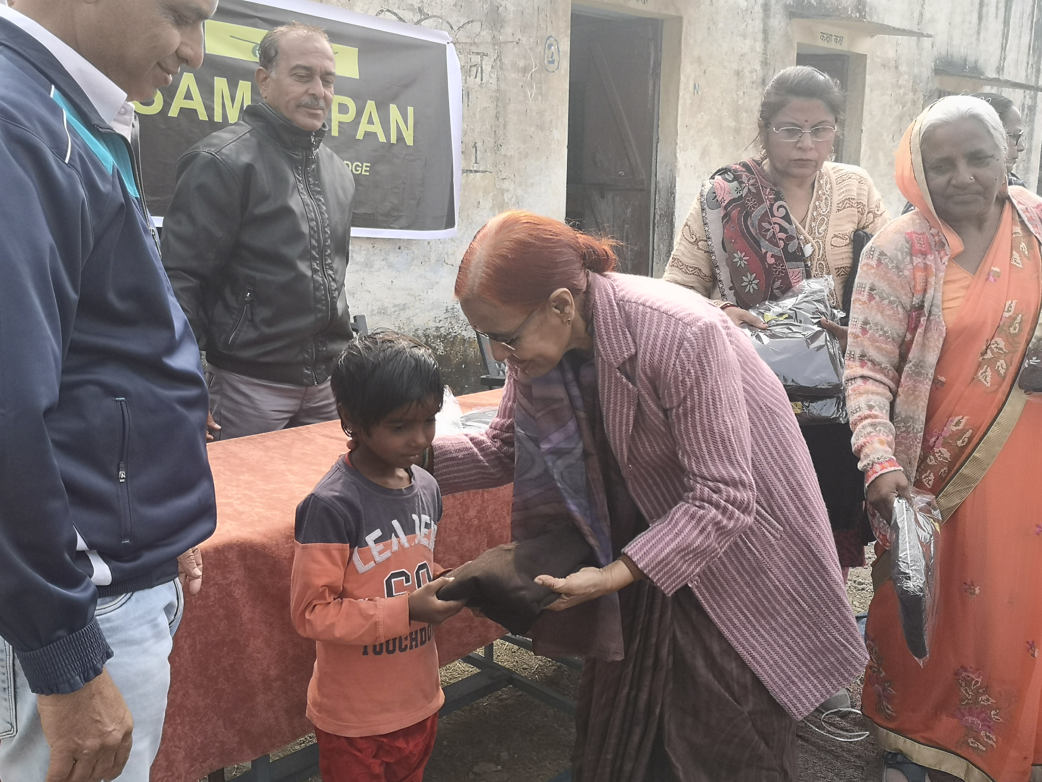 Copy books and stationery are also distributed to children.