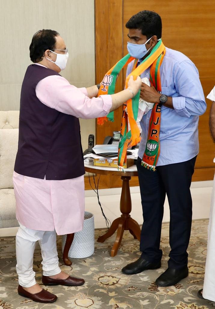 BJP national president J P Nadda while facilitating former IPS Annamalai Kuppusamy