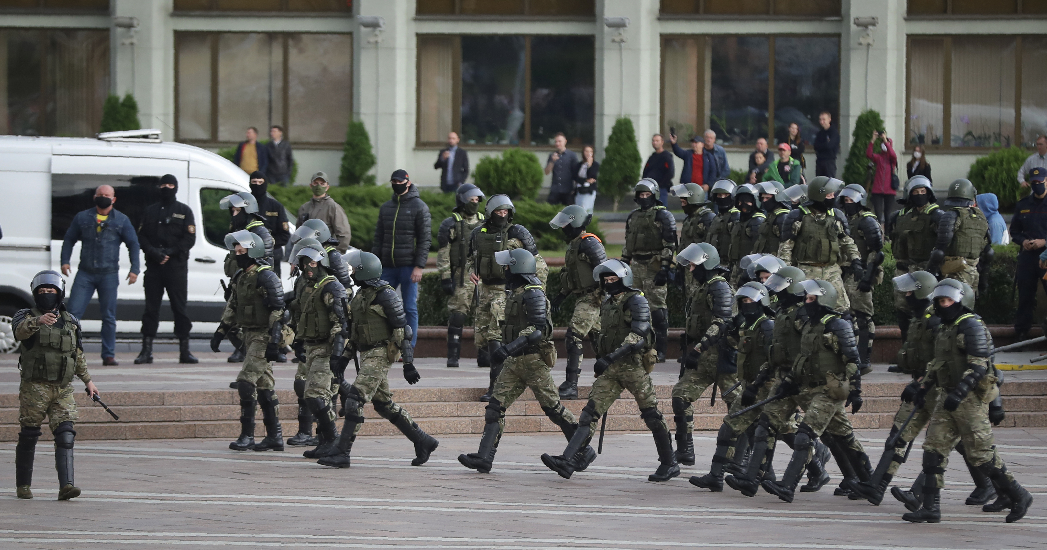 Riot police block the way during a protest at the Independence Square in Minsk, Belarus, Thursday.