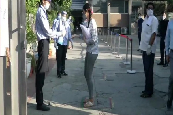 Students arrive at examination centre in Delhi