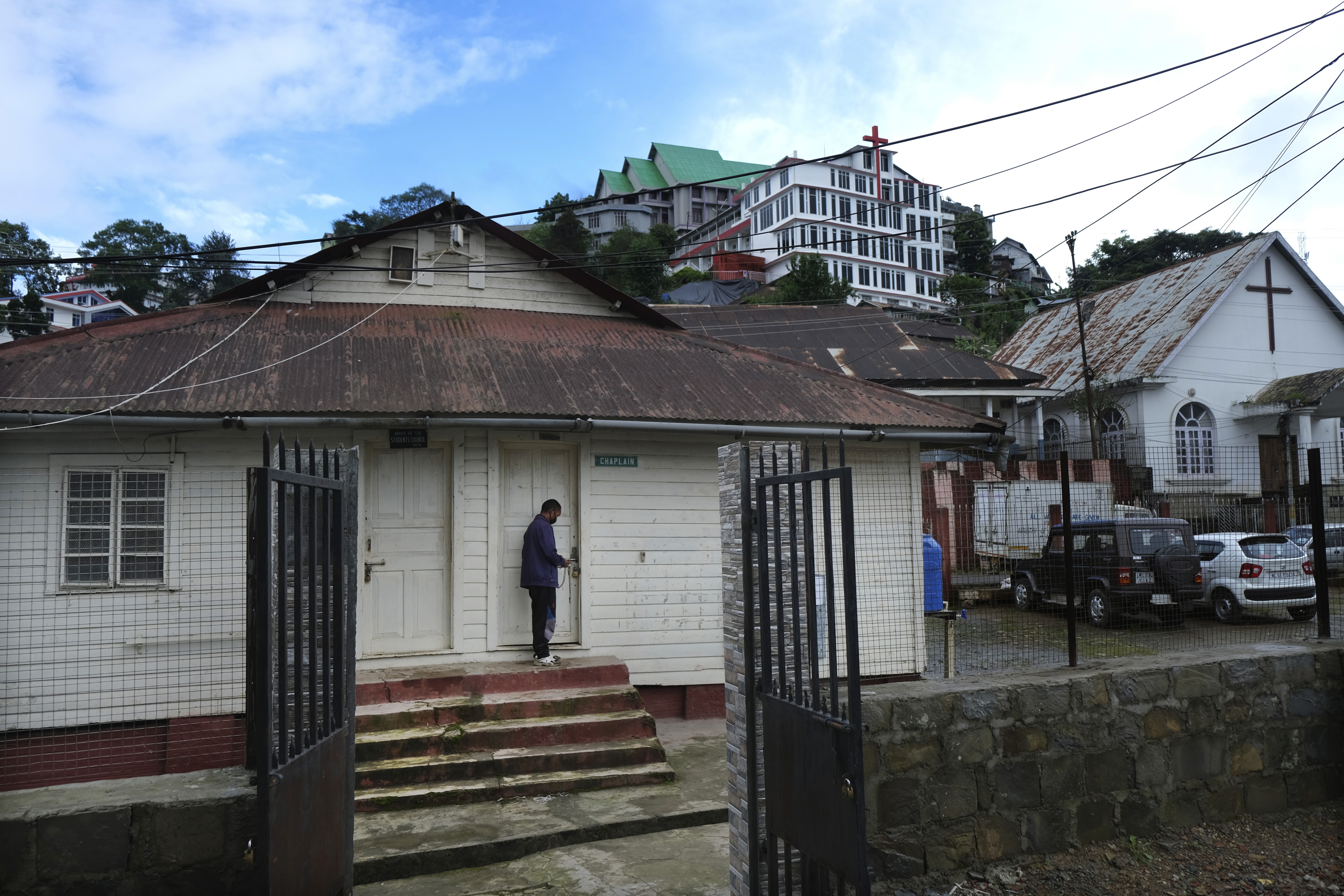 A caretaker locks the door of a house that was one of the only houses standing after British aircrafts bombed and flattened the area in a bid to evacuate Japanese soldiers in World War II, in Kohima. (File)