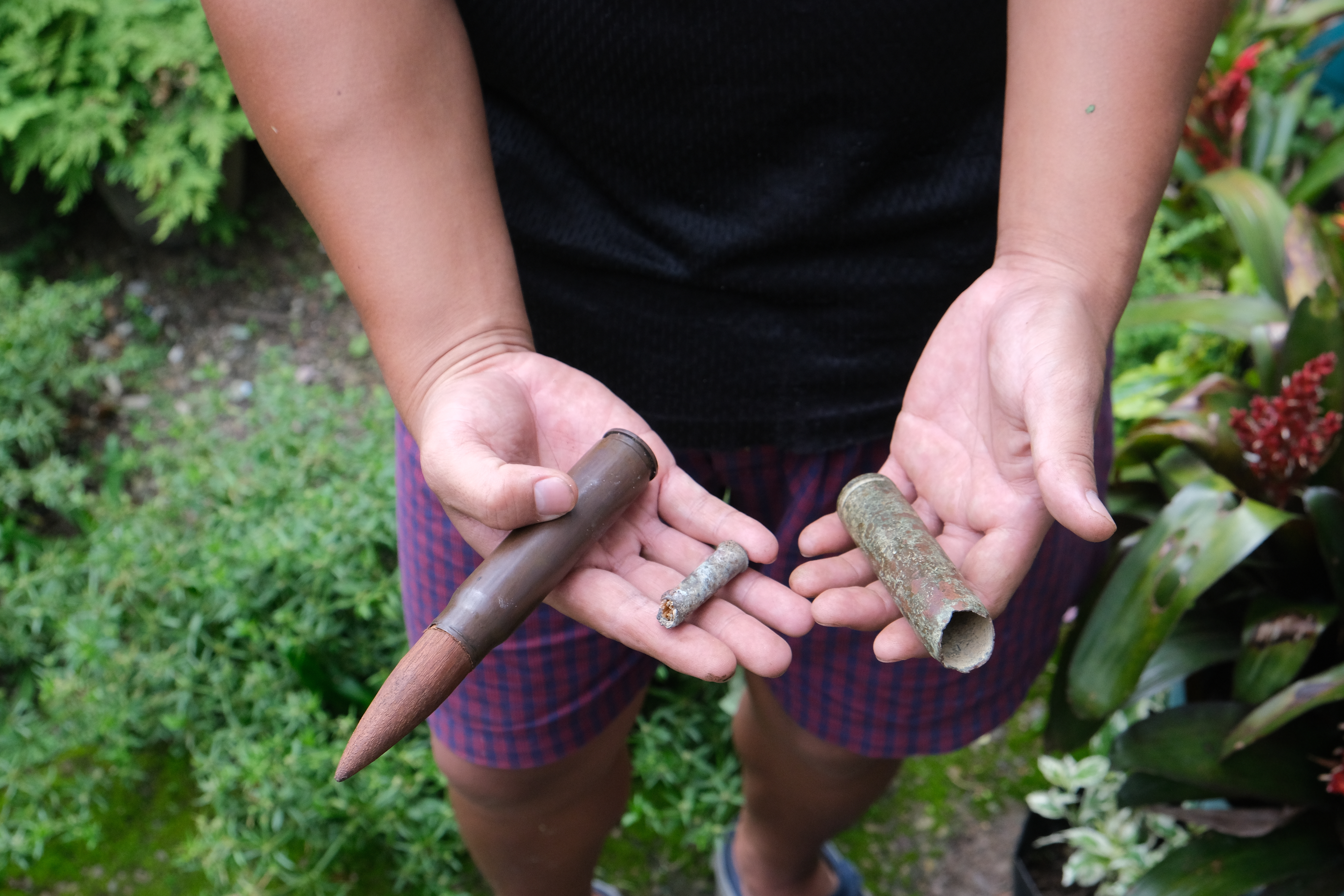 An Angami Naga boy Viketouzo Miachieo displays ammunition from World War II that he found a few years ago while cleaning the area beside his house in Kohima village, in the northeastern Indian state of Nagaland. (file pic)