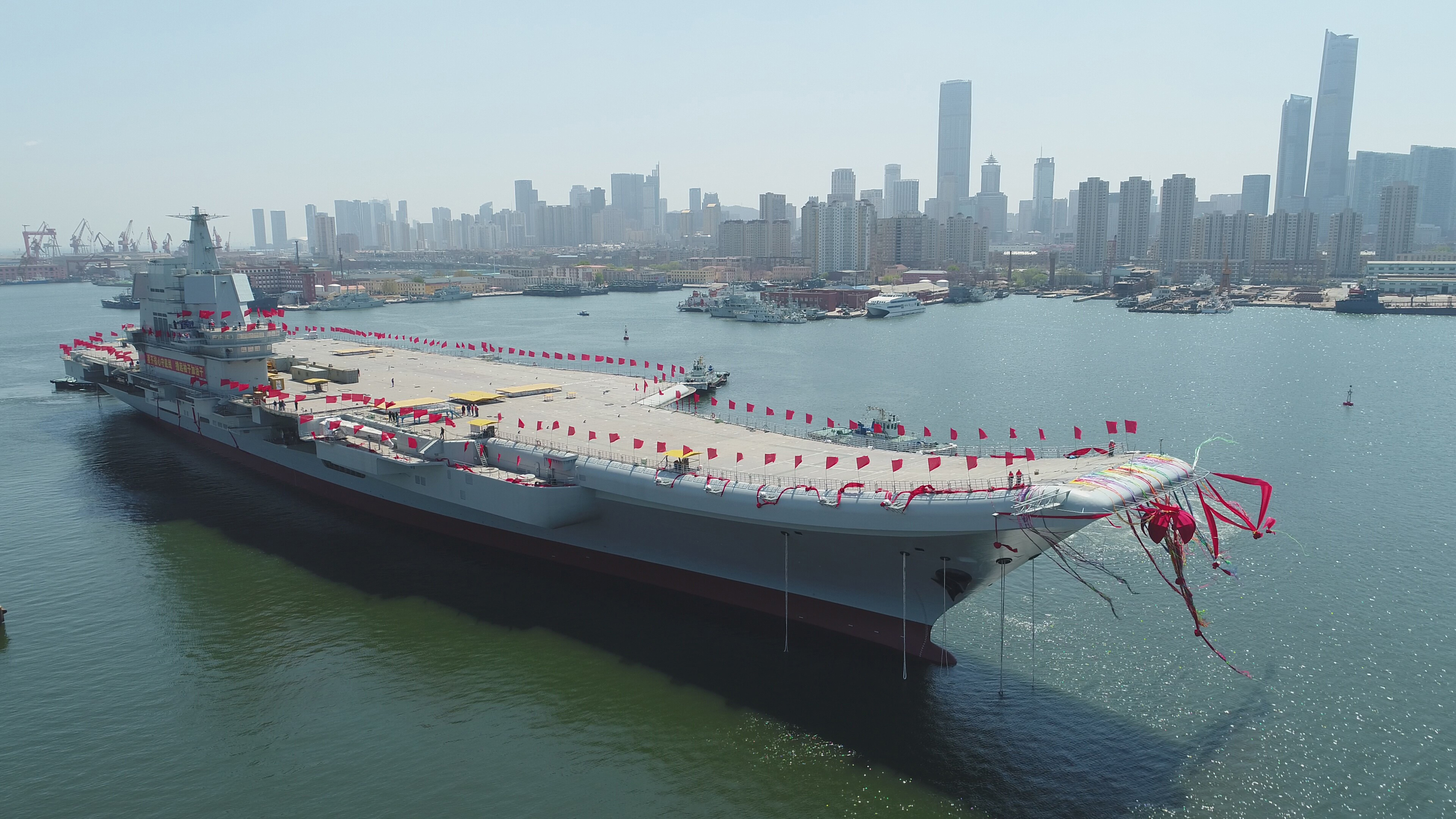 A newly-built aircraft carrier then unnamed is transferred from dry dock into the water at a launch ceremony at a shipyard in Dalian in northeastern China's Liaoning Province. (file)