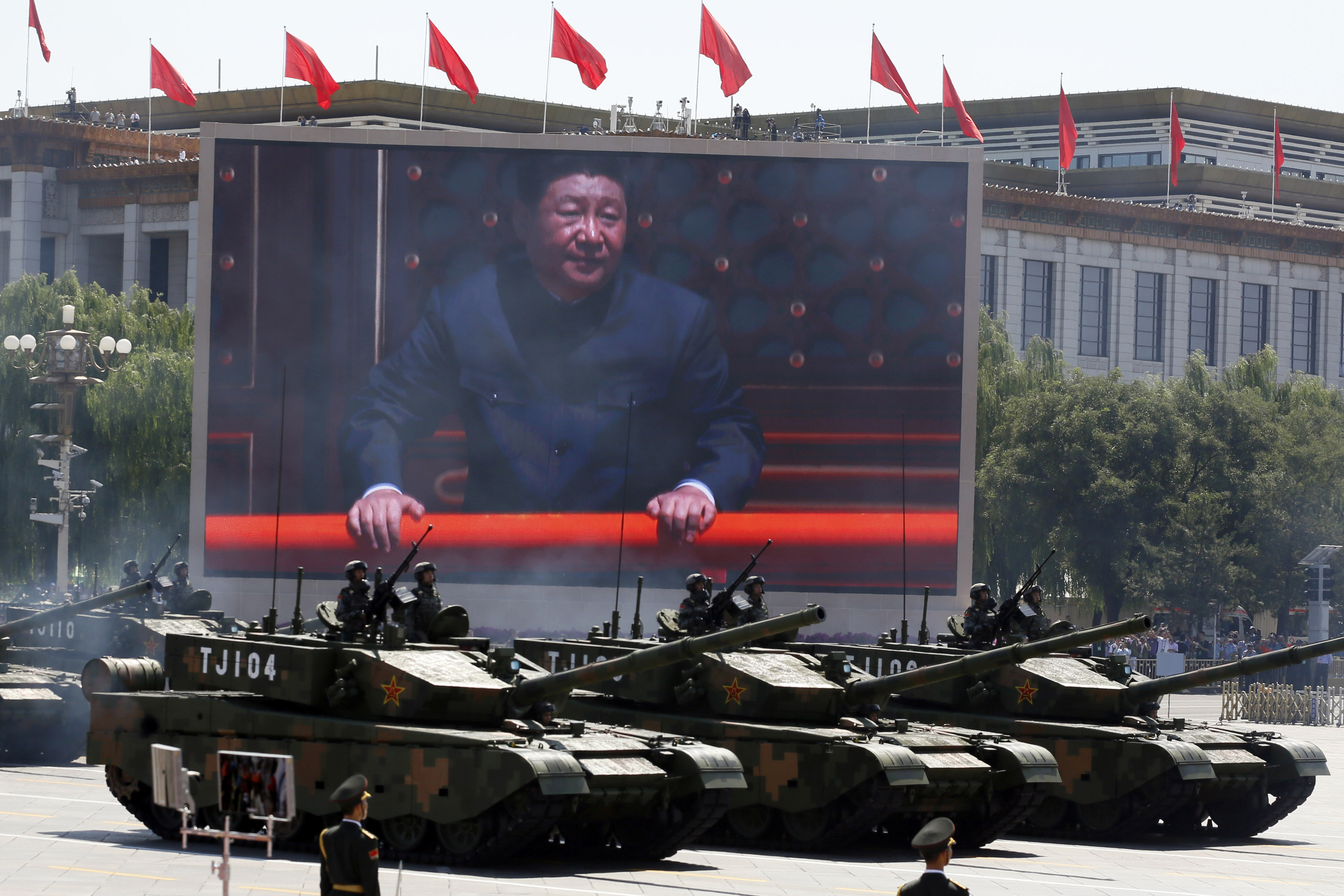 Chinese President Xi Jinping is displayed on a screen as Type 99A2 Chinese battle tanks take part in a parade commemorating the 70th anniversary of Japan's surrender during World War II held in front of Tiananmen Gate in Beijing. (File)