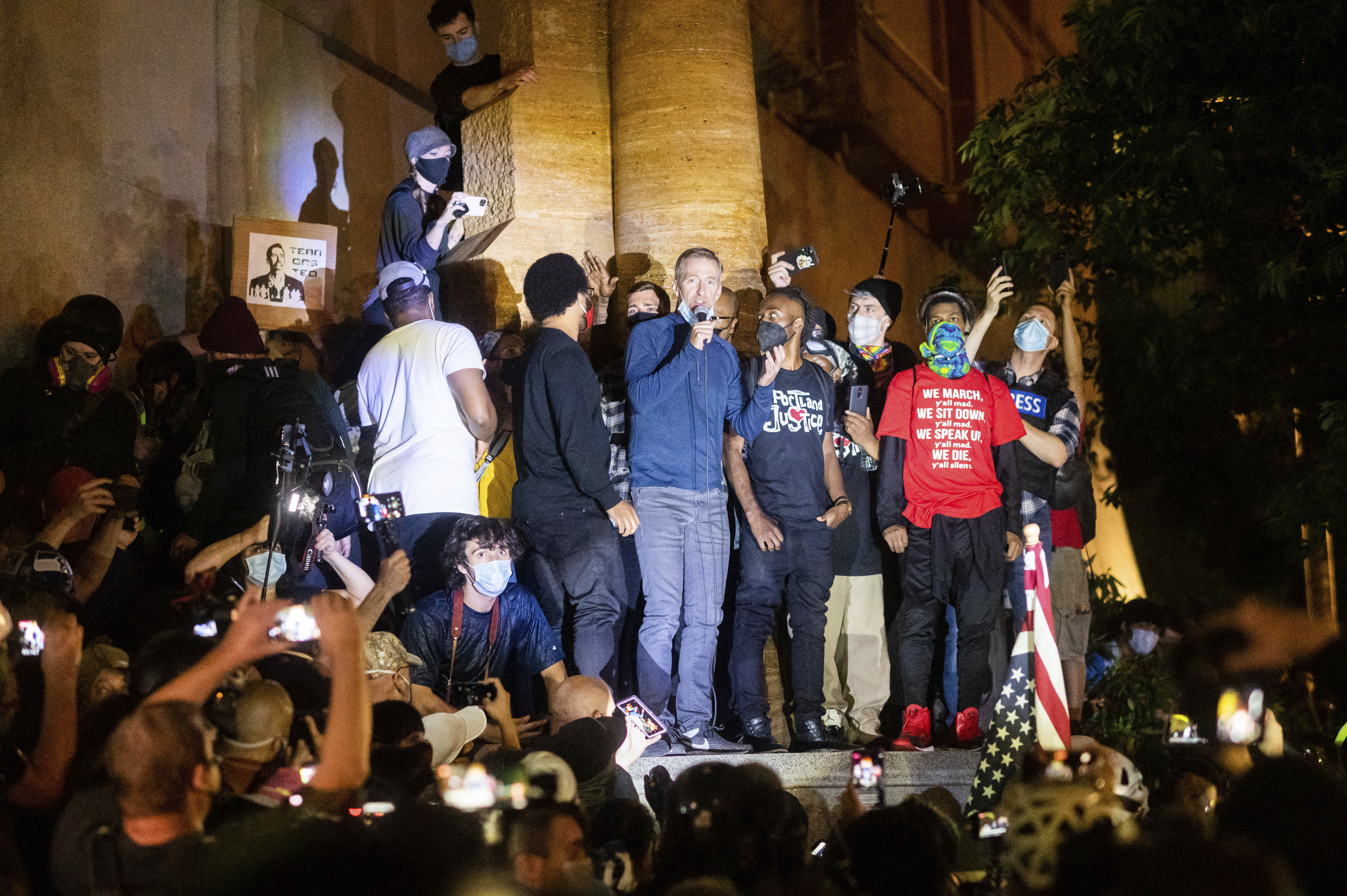 In this July 22, 2020, file photo, Portland Mayor Ted Wheeler speaks to Black Lives Matter protesters in Portland, Ore.