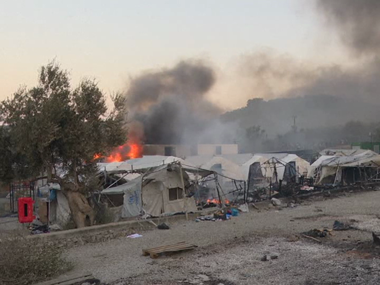 Fires at Greek migrant camp force evacuation during lockdown