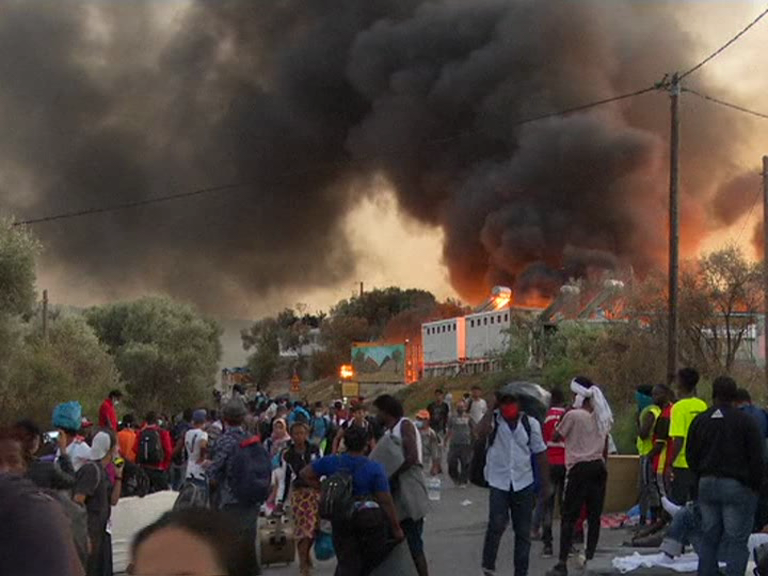 Fires at Greek migrant camp force evacuation during lockdown