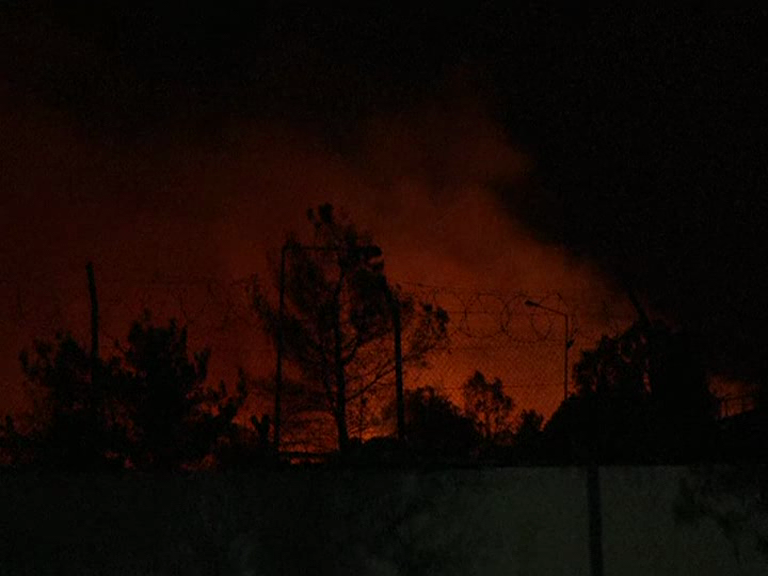 Fires at Greek migrant camp force evacuation during lockdown