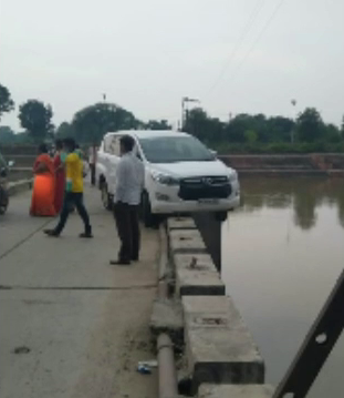 Car half-hung in chhota pool railing near by Mangalnath temple in Ujjain