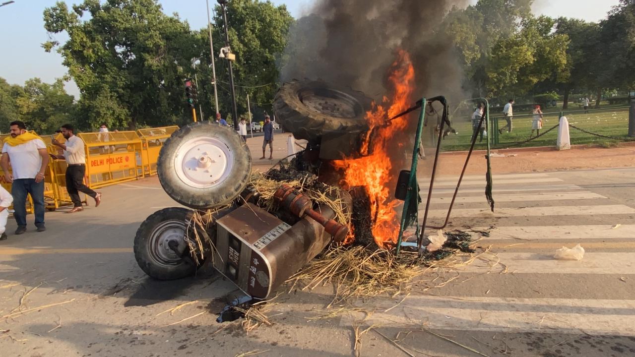 Youth Congress workers torch tractor during protest near India Gate