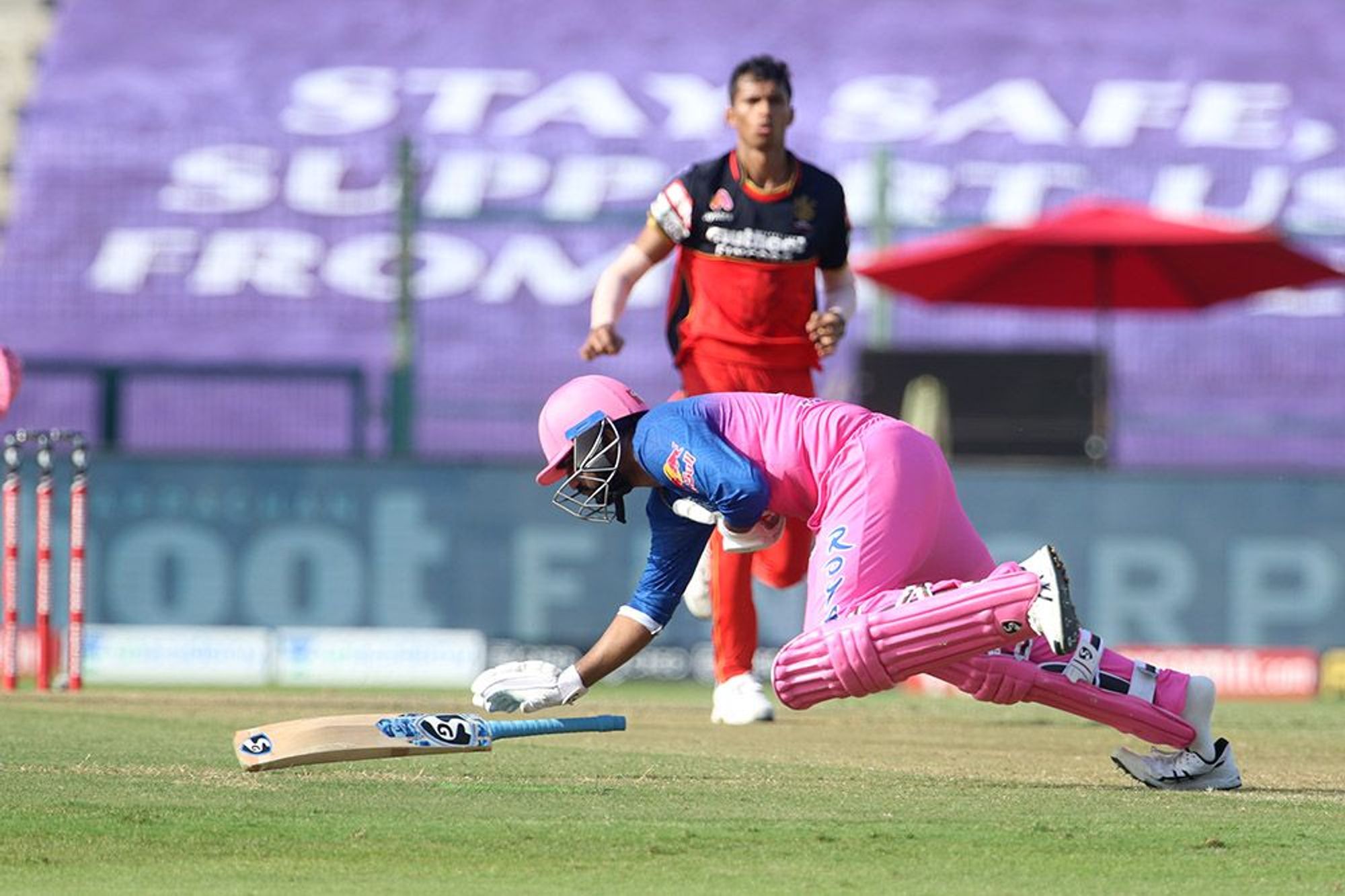 Rahul Tewatia was hit to the ground by a Navdeep Saini delivery in the 20th over.