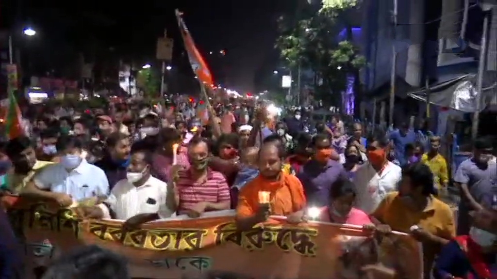 BJP workers hold a candlelight vigil in Kolkata against the state government