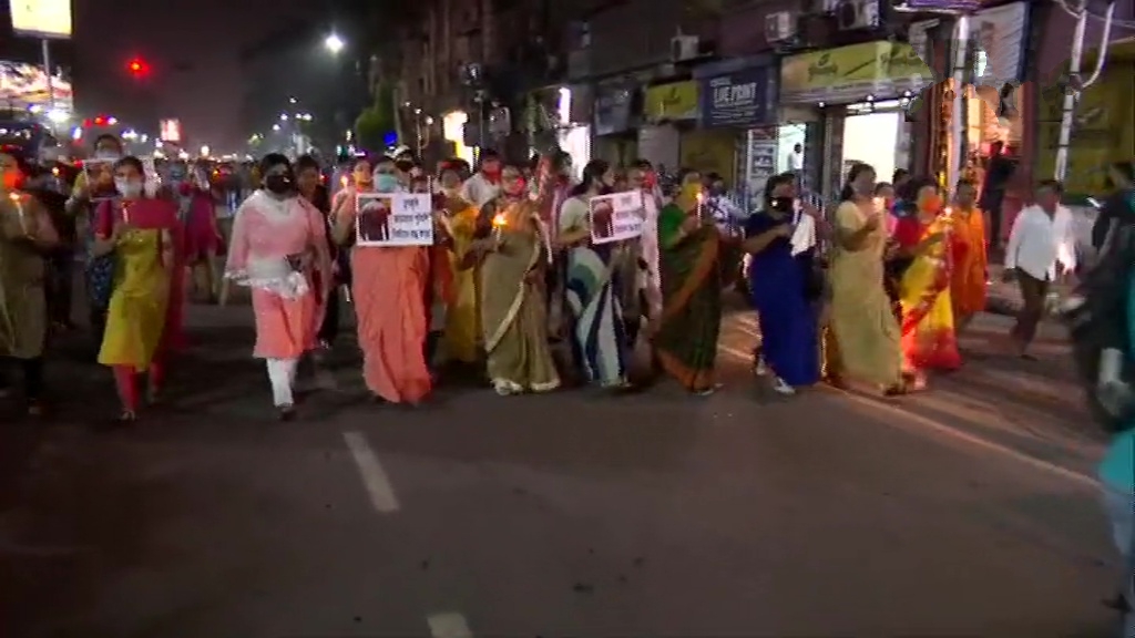 BJP workers hold a candlelight vigil in Kolkata against the state government