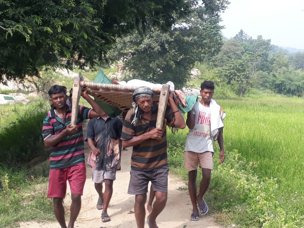 Desperate villagers carry the girls bitten by snake to hospital.